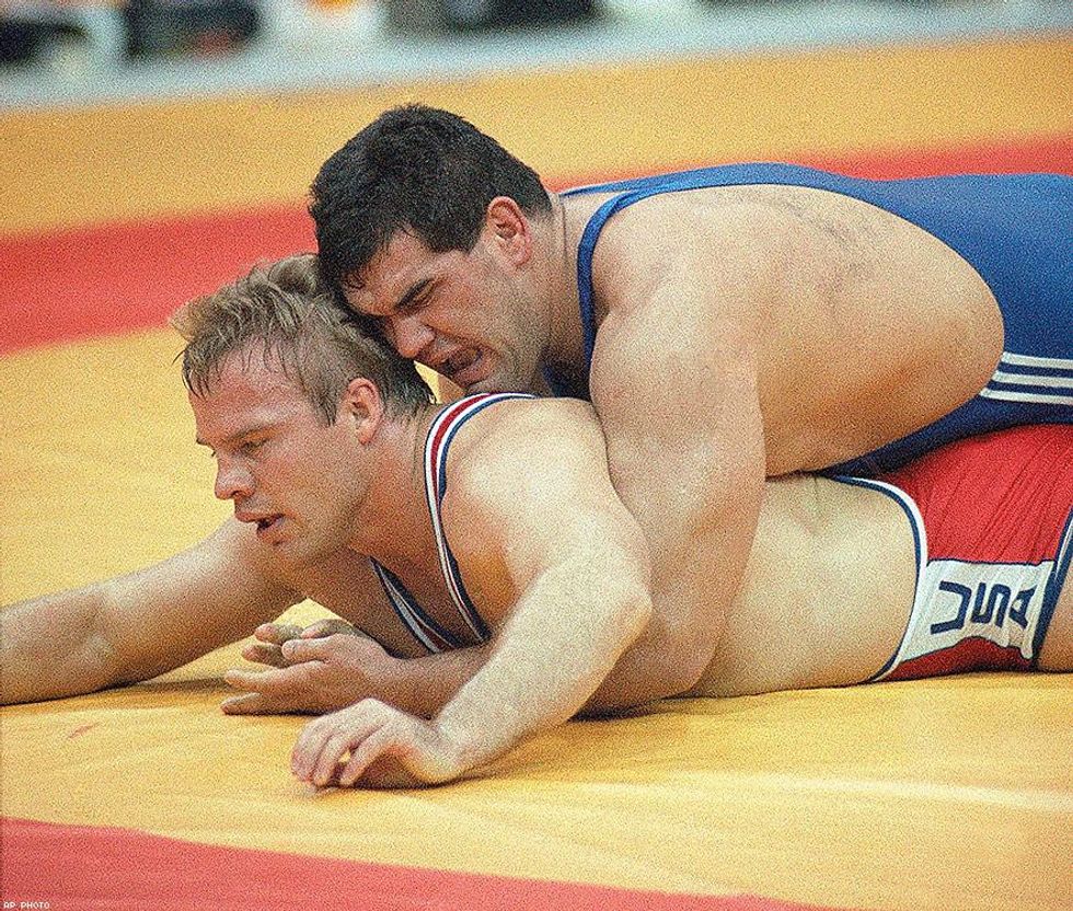 1988: United States wrestler Duane Koslowski of Minneapolis (bottom) struggles helplessly underneath Hungary's Laszlo Klauz in Seoul.