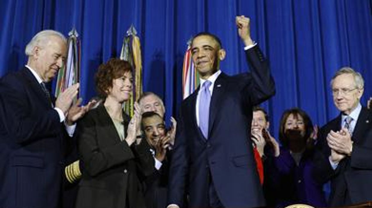 1obamasignsdadtrepeal