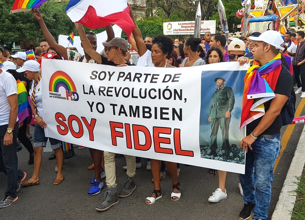 2018 Havana Cuba LGBTQ Pride Parade banner reads I am part of the revolution I am also Fidel with photo of Castro