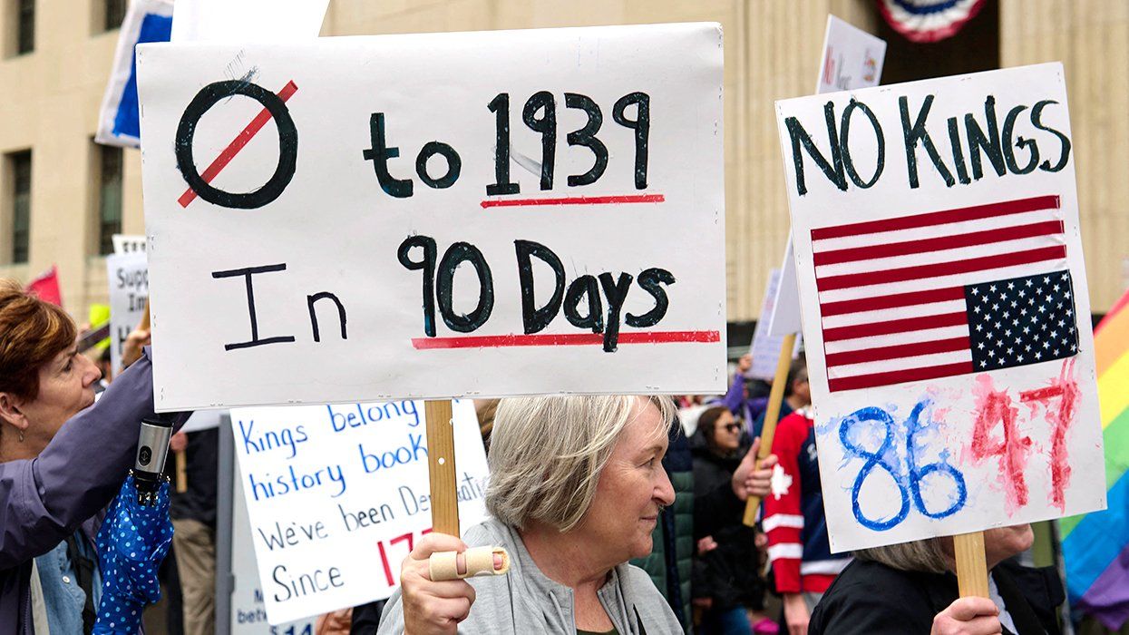50501 movement protest march through downtown Detroit Michigan sign says NO KINGS 86 47