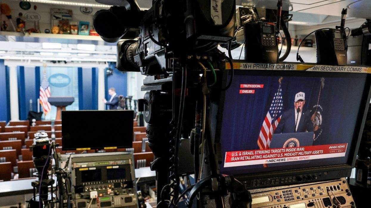 a control panel, monitor and camera in the white house press briefing room showing donald trump on a small tv