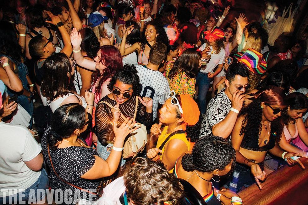 A crowd revels at Henrietta Hudson bar in NYC