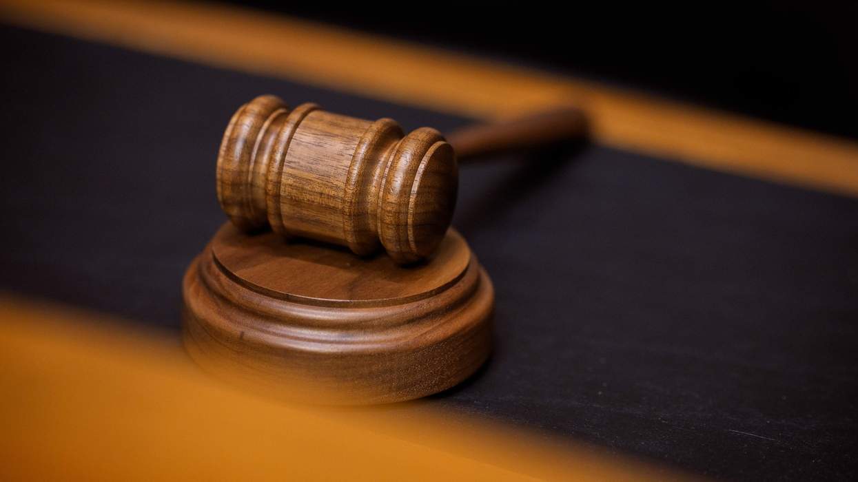 A gavel sits on a desk.