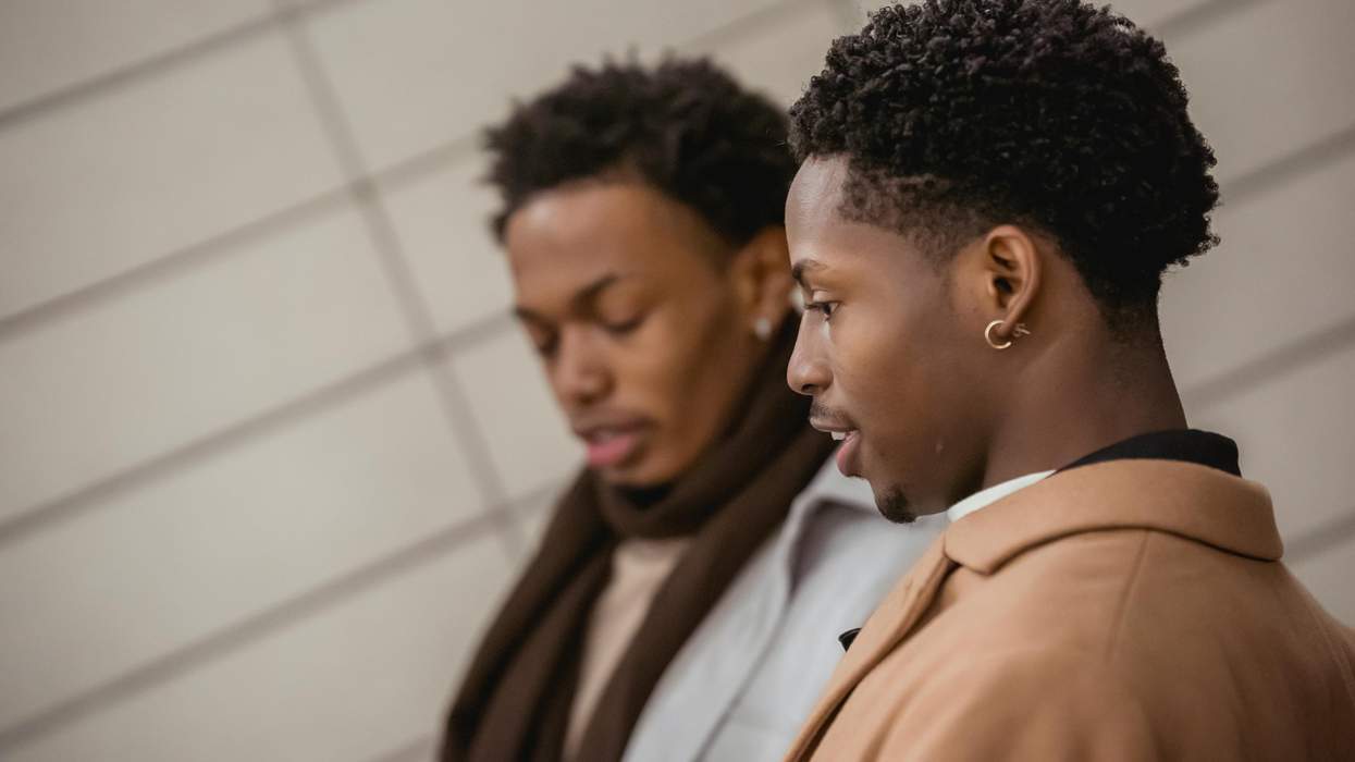 a gay black couple talking