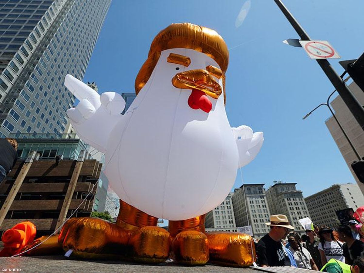 A giant inflatable "Chicken Don" is set up by demonstrators protesting President Donald Trump's failure to release his tax returns