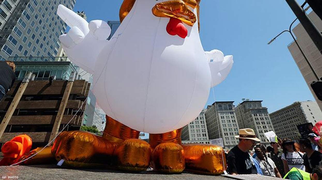 A giant inflatable "Chicken Don" is set up by demonstrators protesting President Donald Trump's failure to release his tax returns