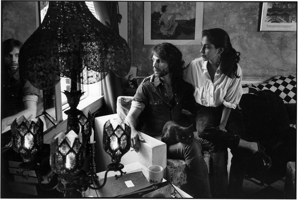 A GMHC buddy visits a client at home.