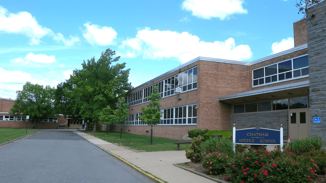 A large school building displays a sign that reads "Chatham Middle School."