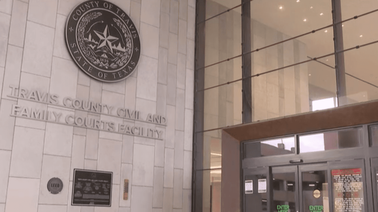 A logo with a star is pictured outside a building with the words Travis County Civil and Family Courts facility on it.