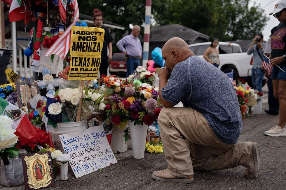 A man pays his respects at vigil held for Lorenzo Salgado Araujo