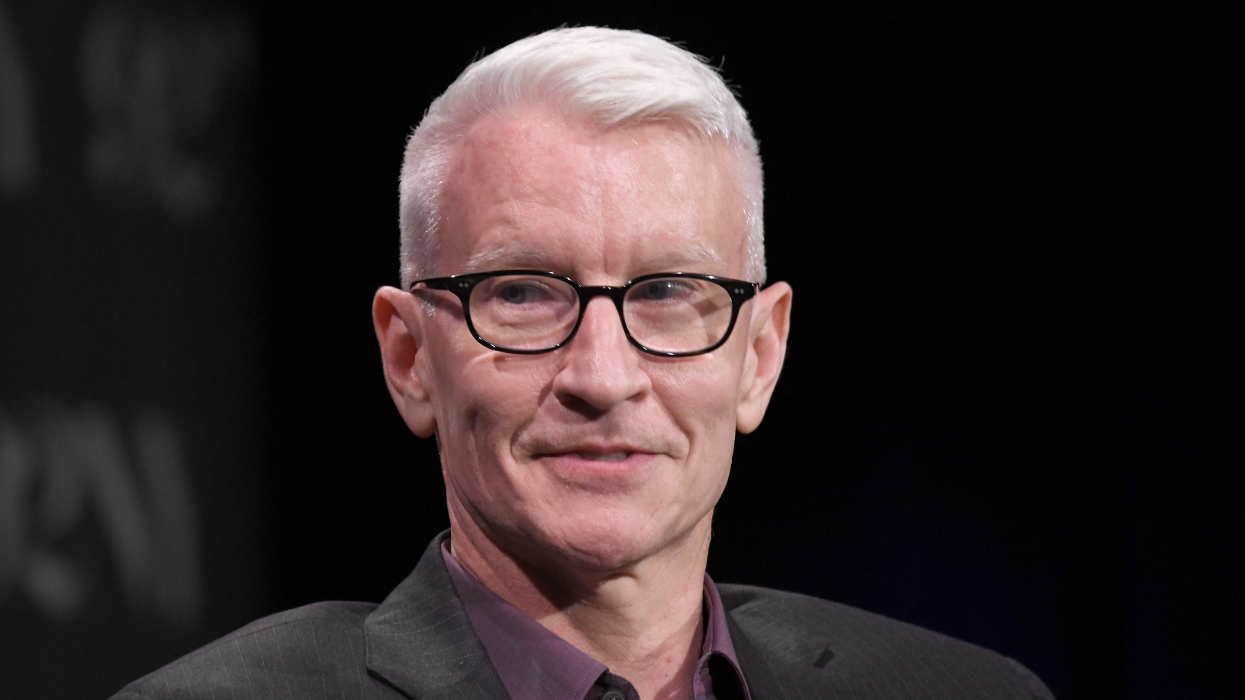 A man with glasses and a suit