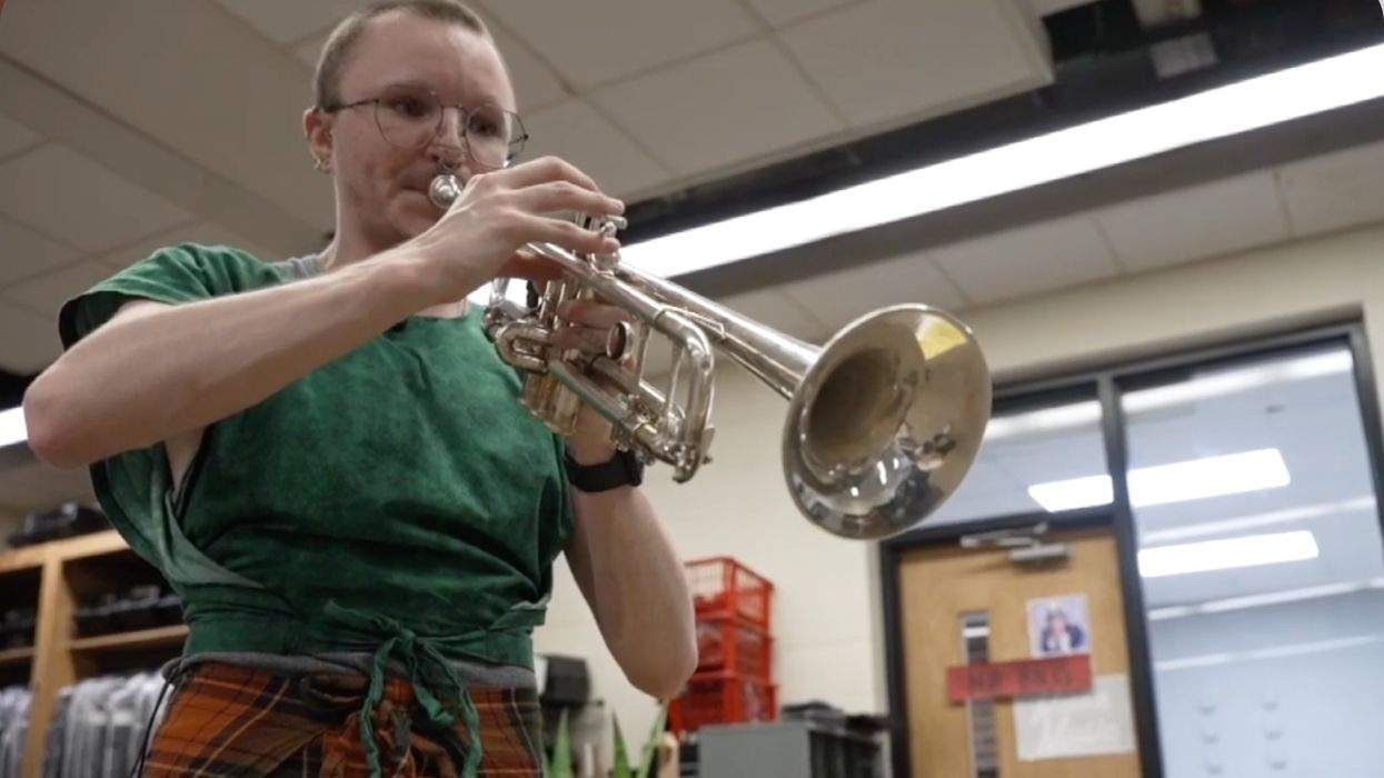 a music teacher playing the trumpet