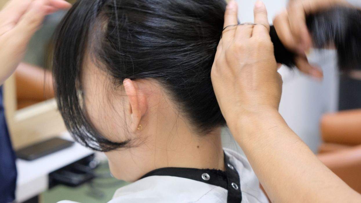 a person getting a hair cut