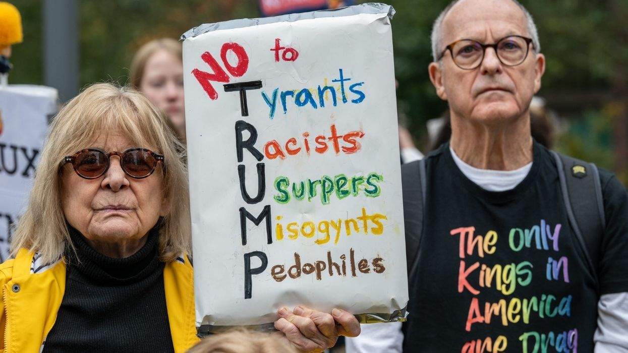 a person holding a sign that says no to tyrants, racists, usurpers, misogynysts and pedophiles and a person wearing a t-shirt that reads the only kings in america are drag kings