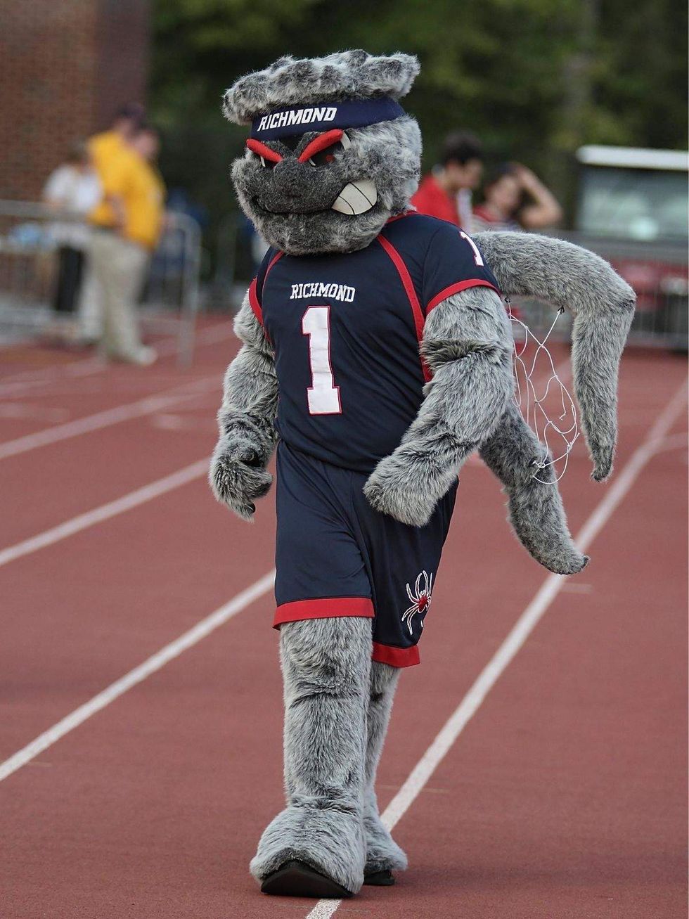 a person in a spider mascot outfit with richmond and the number one on the characters chest