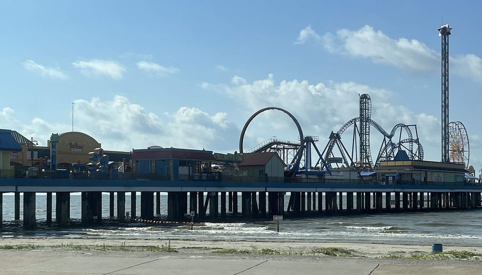 A pier with roller coasters in Galveston County, Texas.