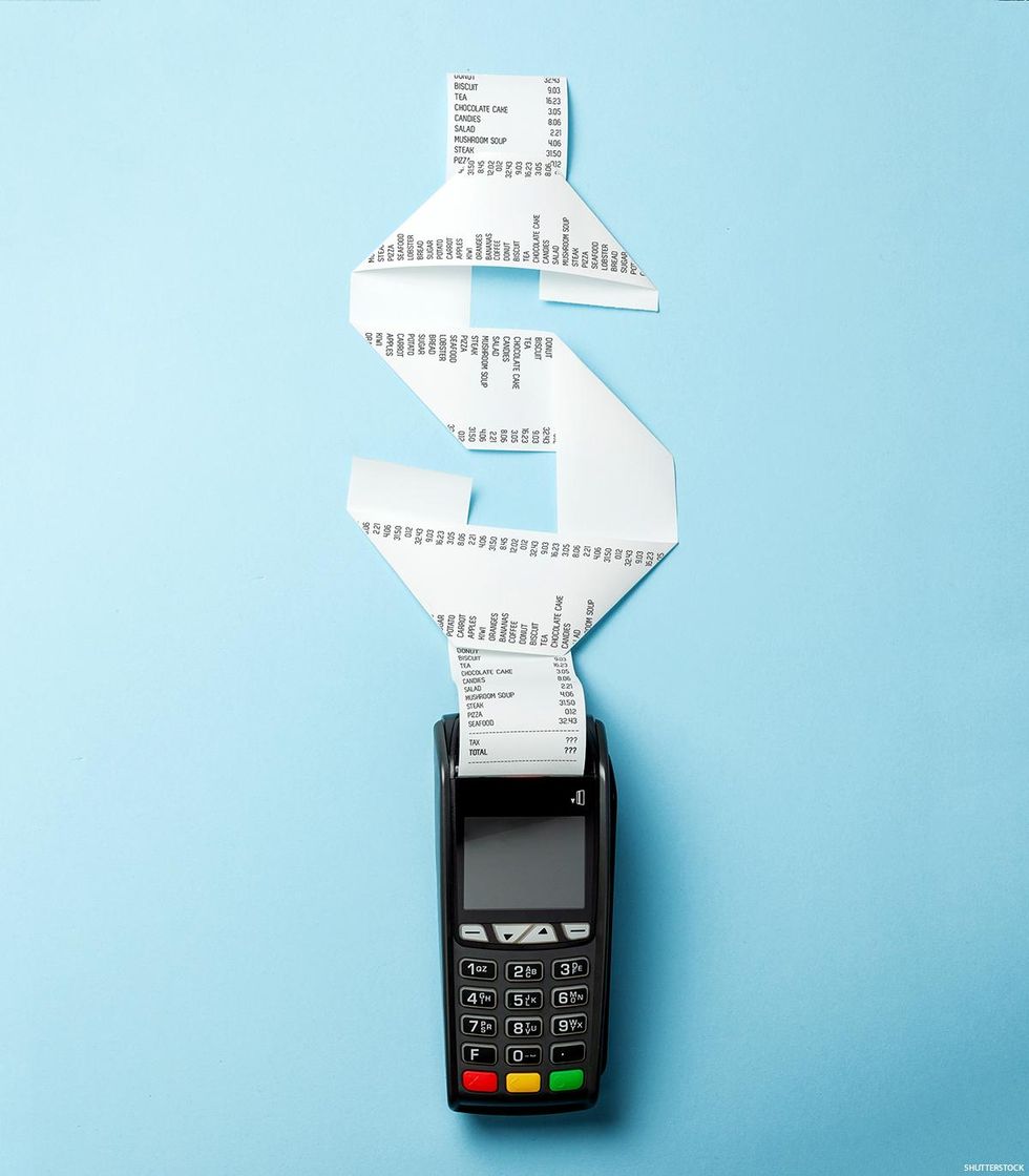 A point of sale reader with a receipt forming a dollar sign coming out.