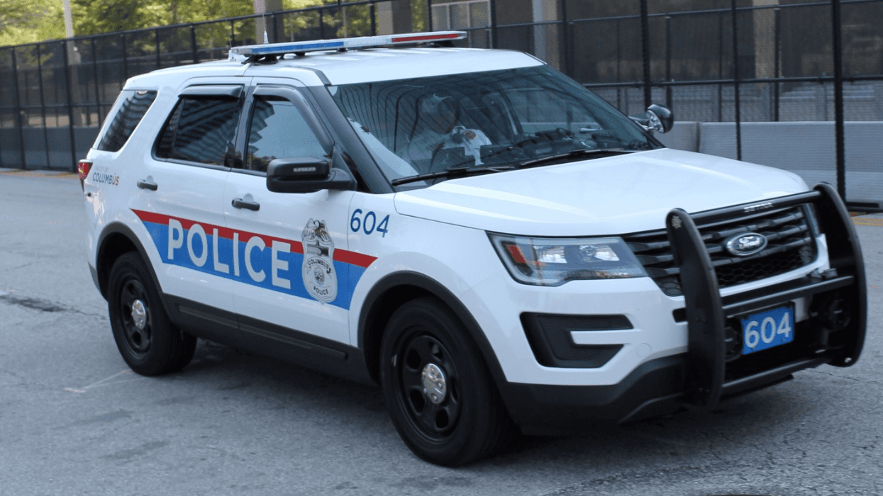 A police car is parked in the road.