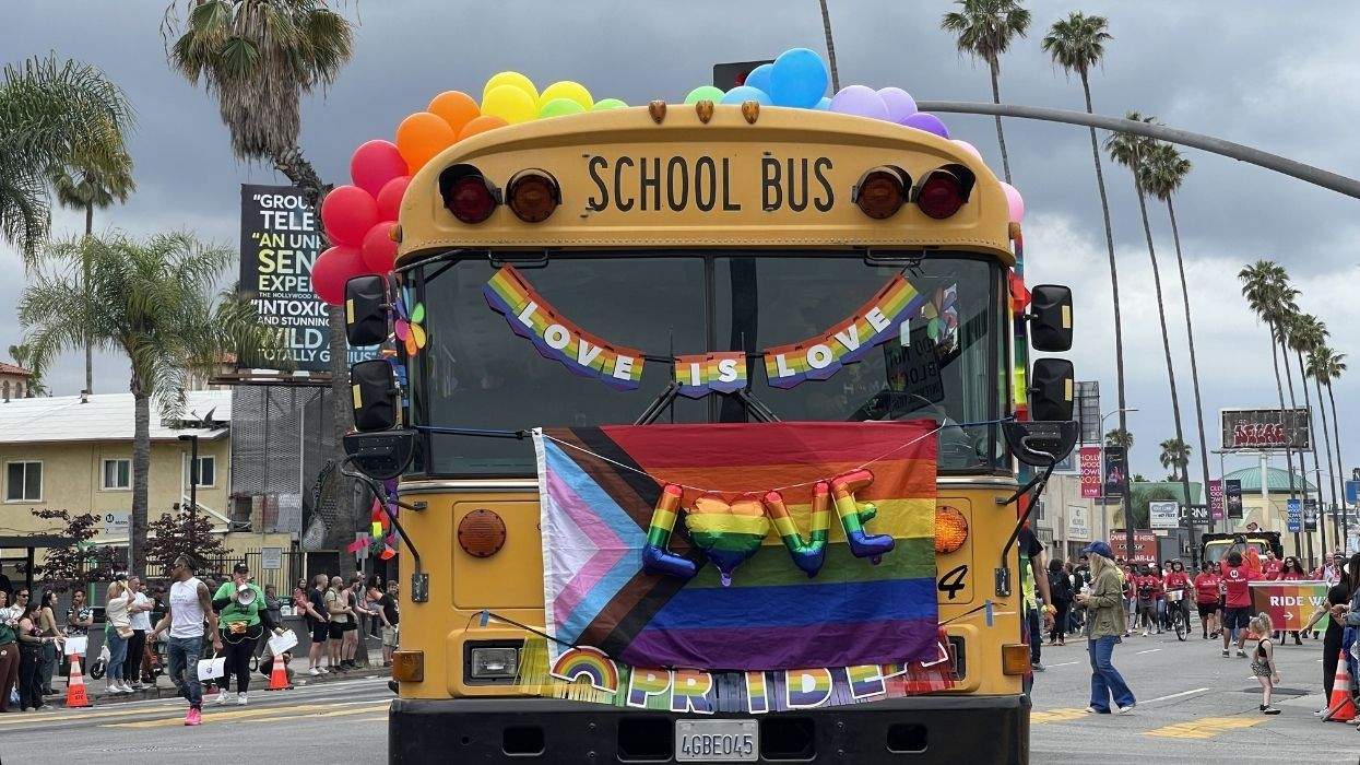 a school bus in california with lgbtq pride flags and messages