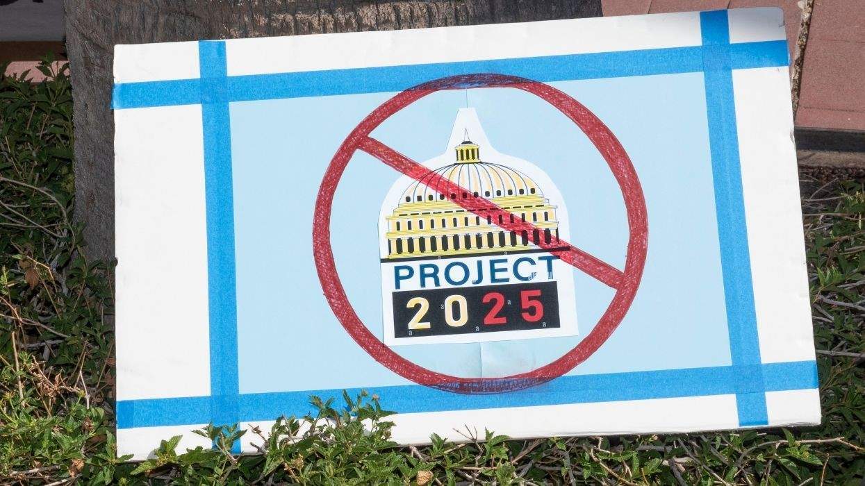 a sign with the capitol dome, project 2025 written underneat, and a circle with a line through it overllaid