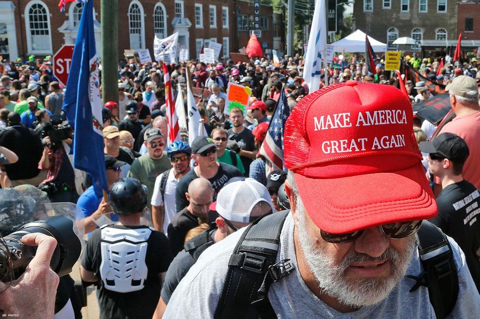 A white nationalist demonstrator walks into Lee Park in Charlottesville, Va., Saturday, Aug. 12, 2017.