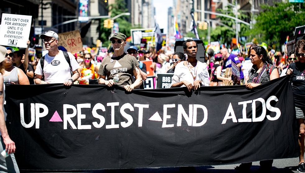 ACT UP AIDS protest banner LGBTQ pride march NYC 2017
