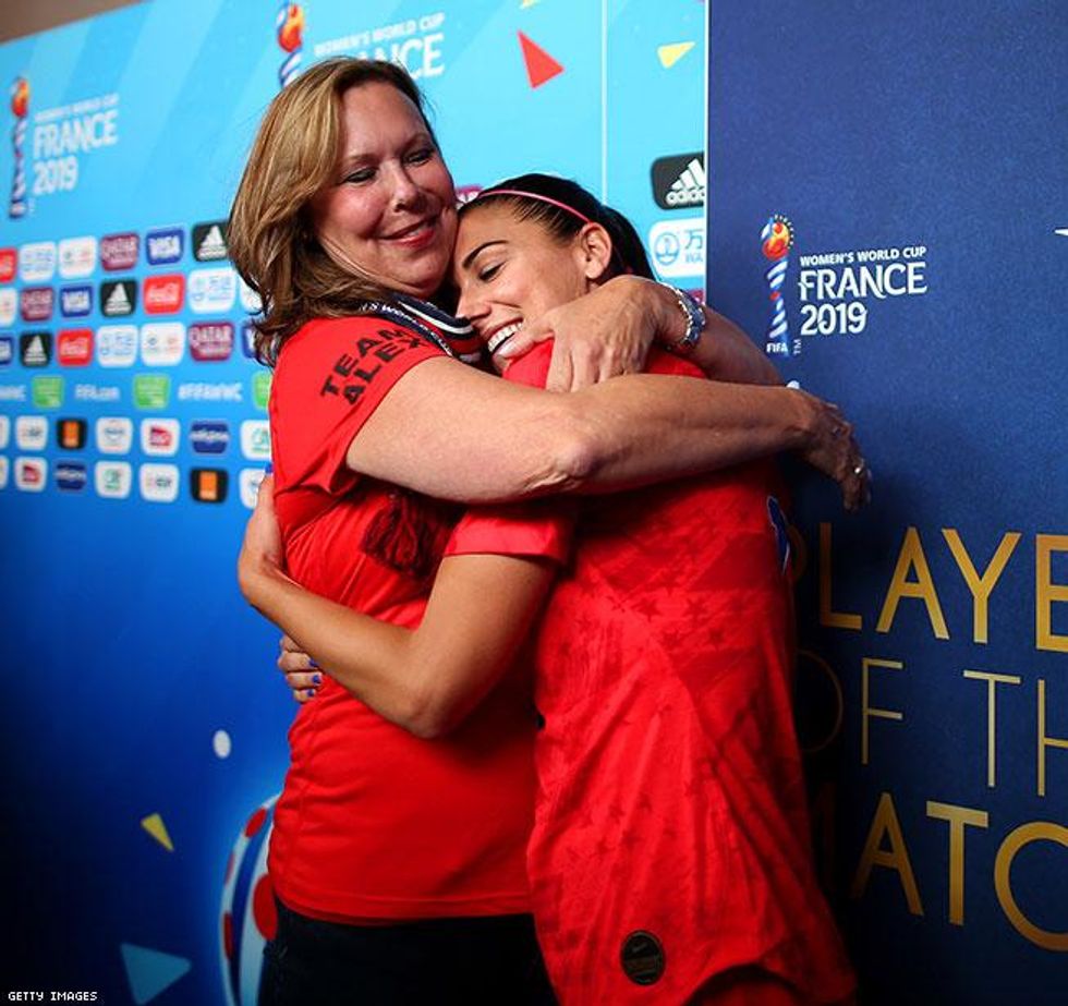 Alex Morgan hugs her mom after the victory over Thailand USWNT Women's World Cup