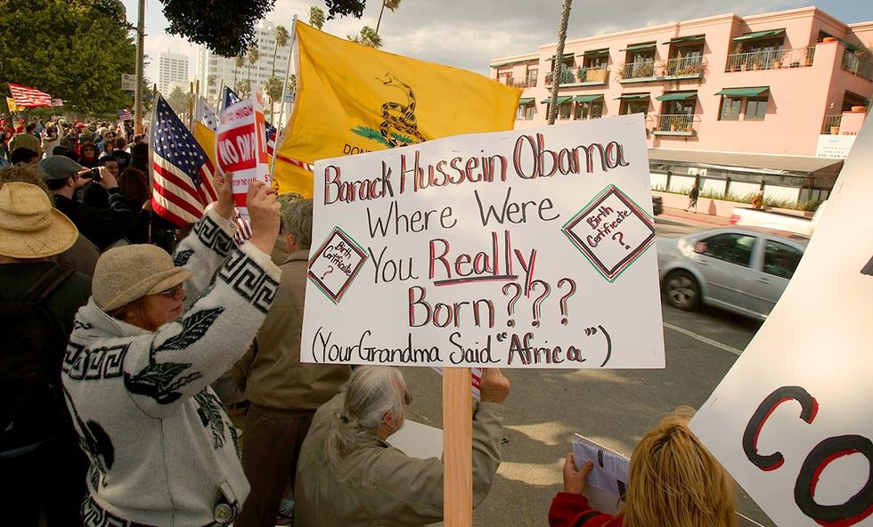 American Family Association Taxed Enough Already TEA Party rally protesting taxes demonstrator questions the citizenship of President Obama
