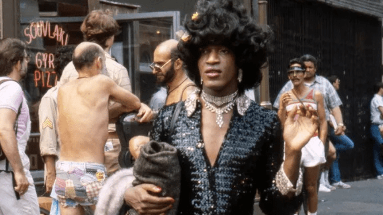 American gay liberation activist Marsha P Johnson (1945 - 1992) on the corner of Christopher Street and 7th Avenue during the Pride March (later the LGBT Pride March), New York, June 27, 1982