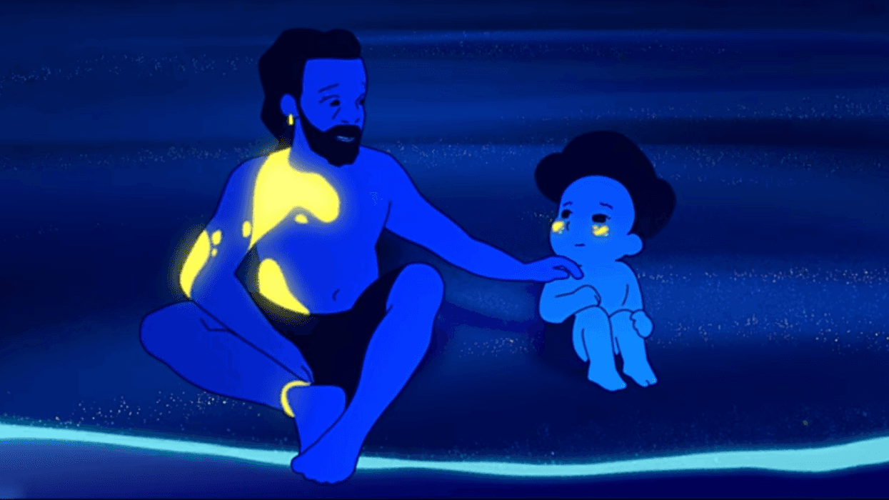 An animated father and young boy sit together at the edge of the ocean at night, rendered in deep blue tones with glowing yellow highlights in a scene from the short film ‘WAVES.’