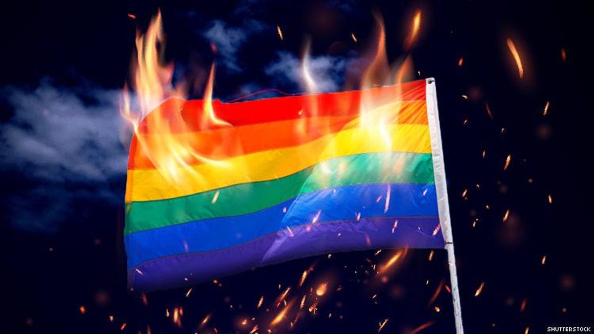 An LGBTQ+ Pride Flag on Fire