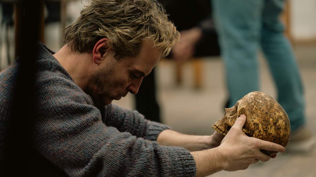 Andrew Scott holding a skull