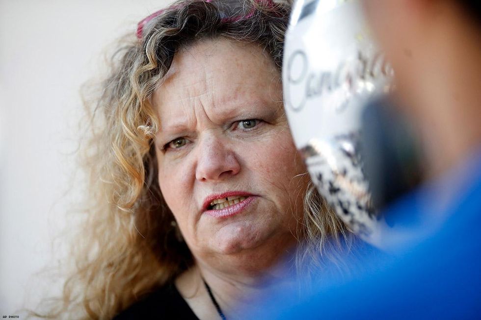 Ann Sewell, a supporter of Masterpiece Cakeshop, talks outside the store.
