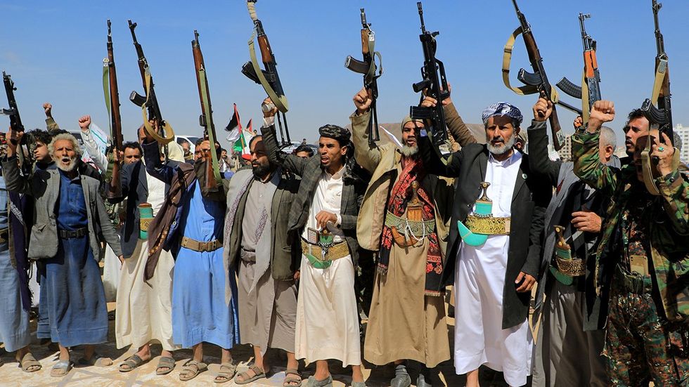 Armed supporters Yemen Houthi rebels rally solidarity Palestinian Hamas movement armed resistance against Israel Yemeni capital Sanaa