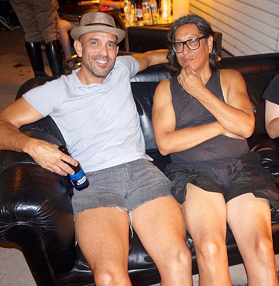 Art star Rick Castro, right, and friend take in the scene.