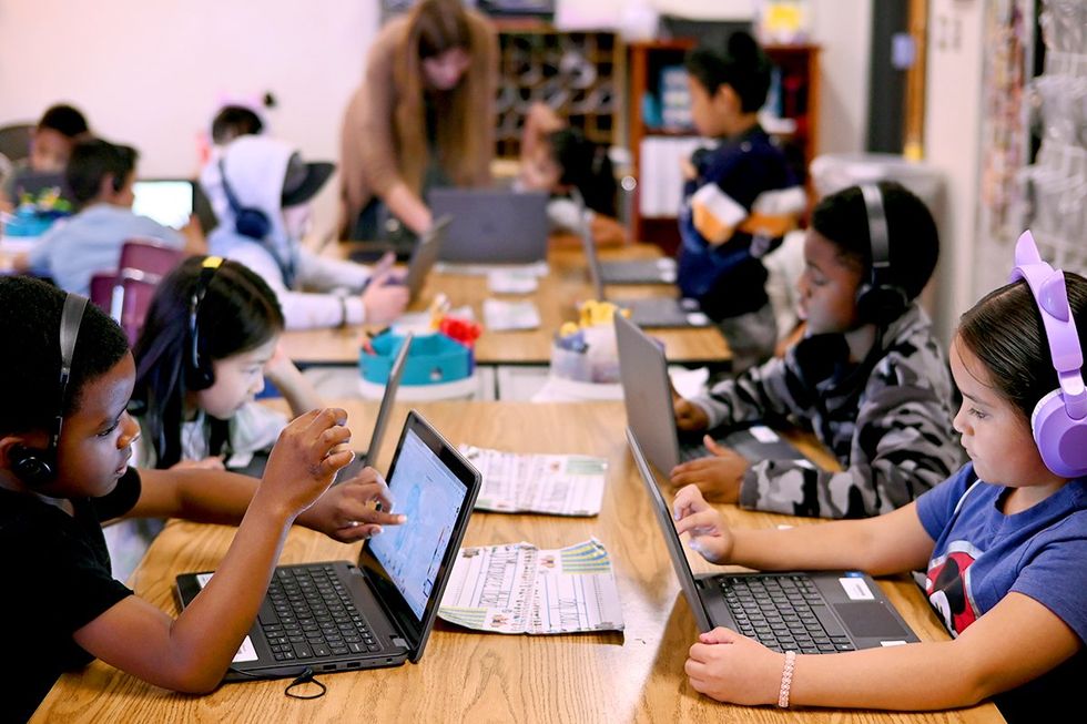 back to school 2024 first graders during new digital reading class at Ponderosa Elementary School Aurora Colorado