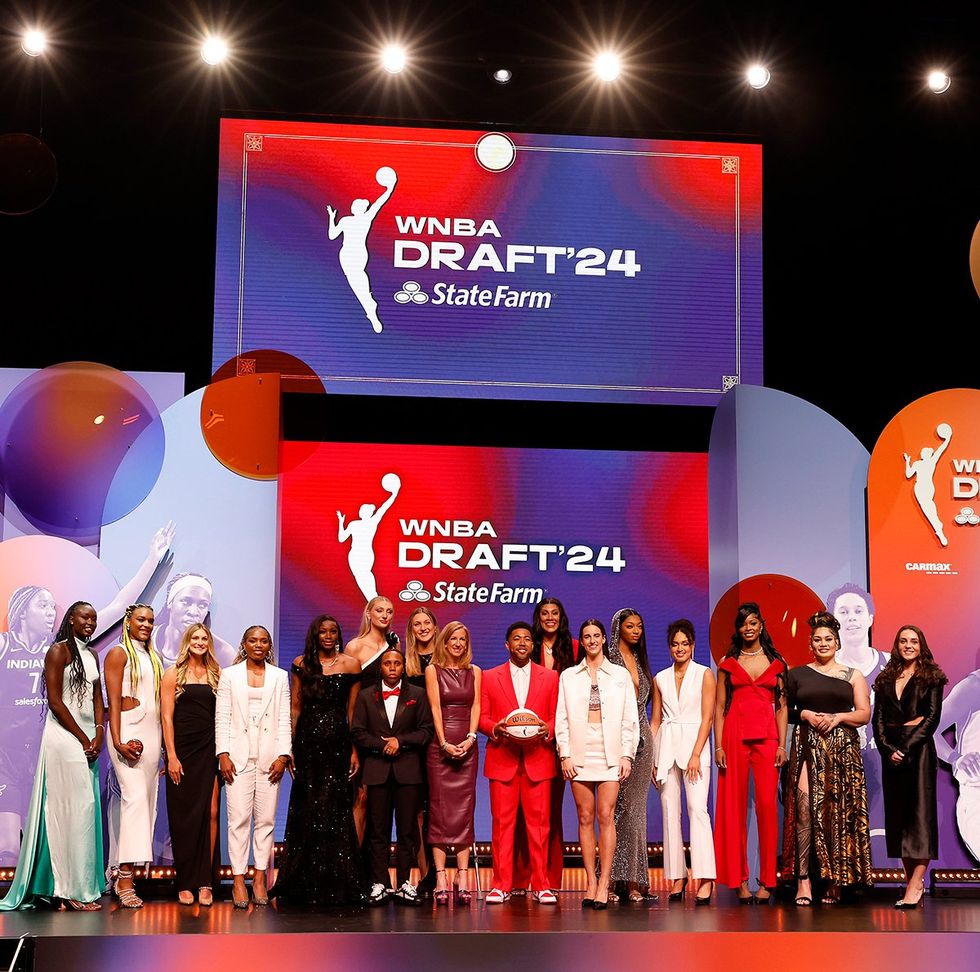 beginners guide to WNBA 2024 Commissioner Cathy Engelbert poses with draftees prior to WNBA Draft Brooklyn Academy of Music New York City