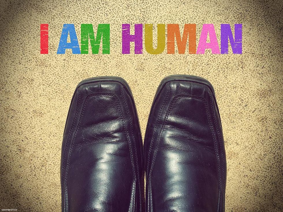 black shoe tips with the words I am human above them