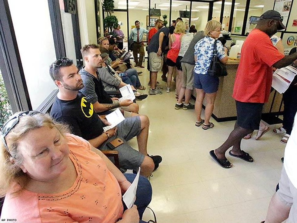 Blood donors fill up the waiting room at the OneBlood blood bank to the help victims.
