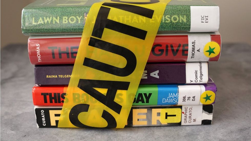 Books wrapped with caution tape that are banned