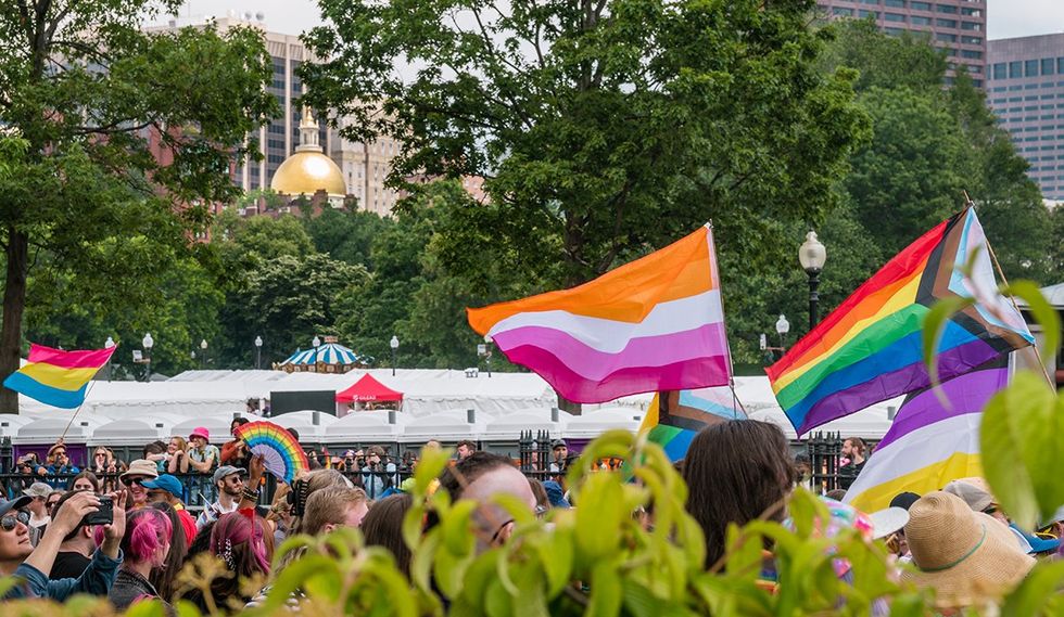 Boston MA LGBTQIA Pride festival 2023 on the Boston Common with massachusetts statehouse in background