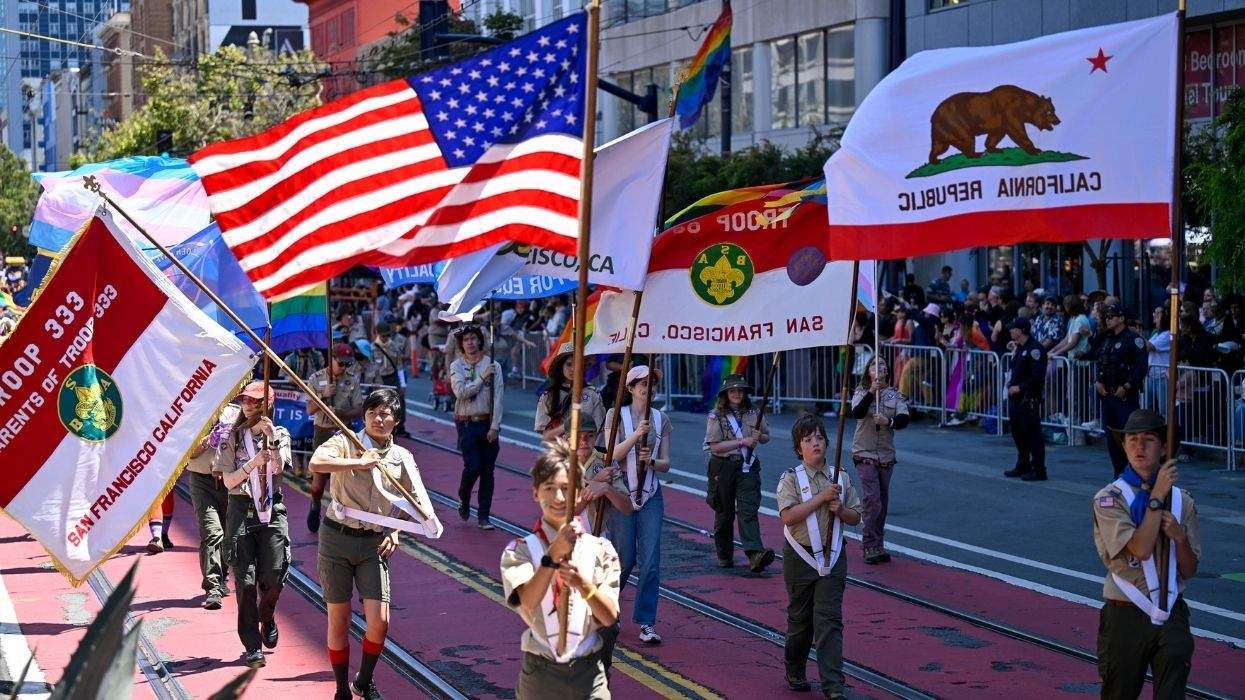boy scouts marching with flags