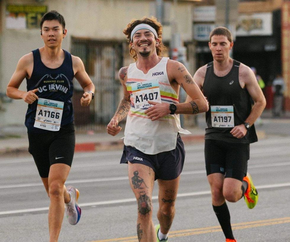 cal calamia running with two other people