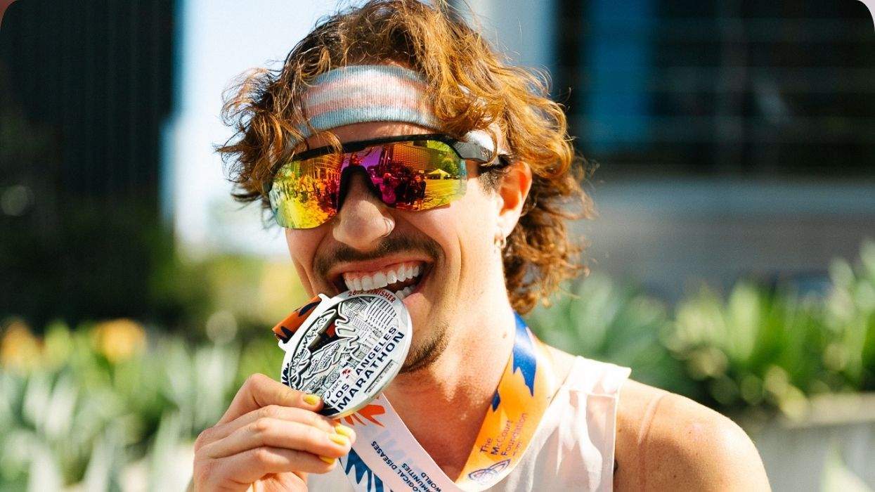 cal calamia with a la marathon medal