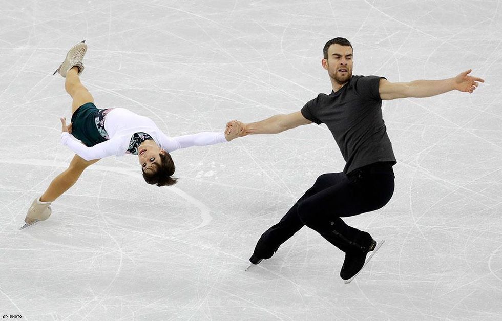Canada's Meagan Duhamel and out competitor Eric Radford perform during a practice session