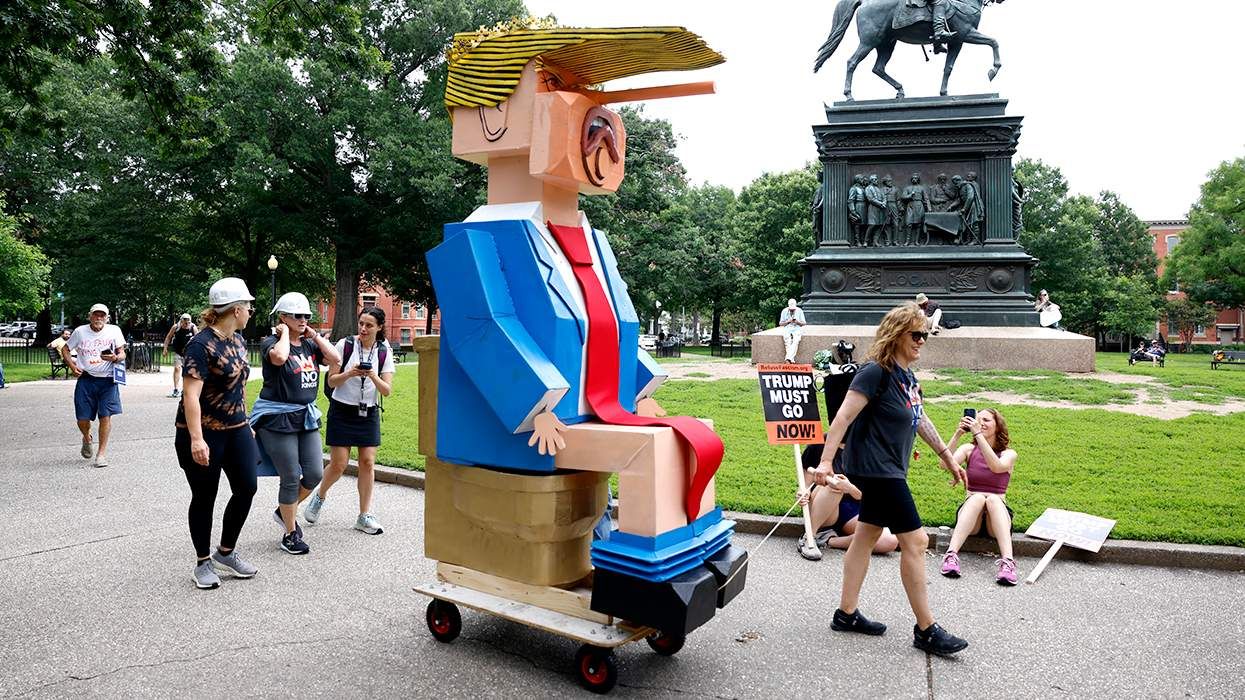 cardboard Trump figure on a gold toilet