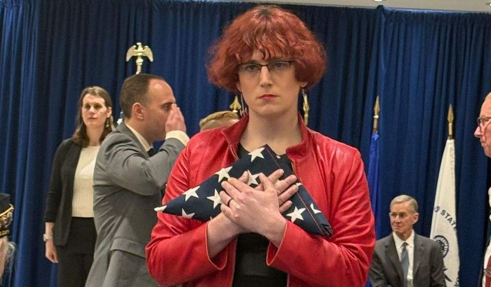 cathrine schmid receives flag