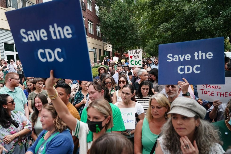 CDC supporters holding signs and cheering outside of the CDC headquarters in Atlanta Georgia