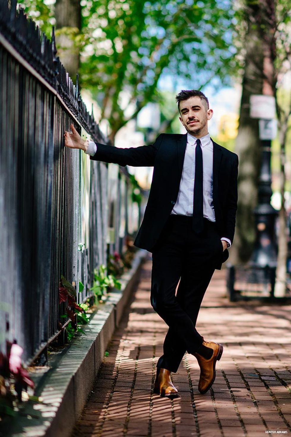 Chase Strangio by a fence.