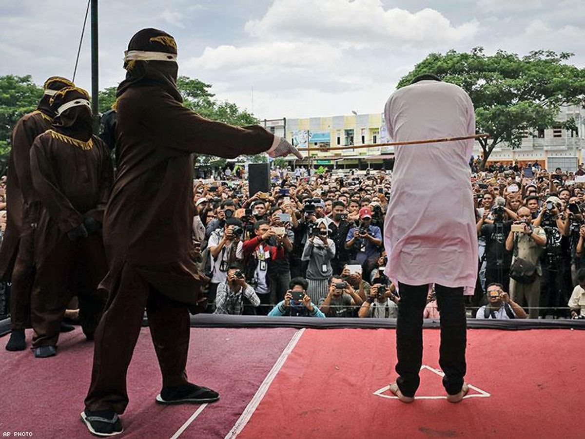 Cheering Crowd Watches Caning of Indonesian Gay Men